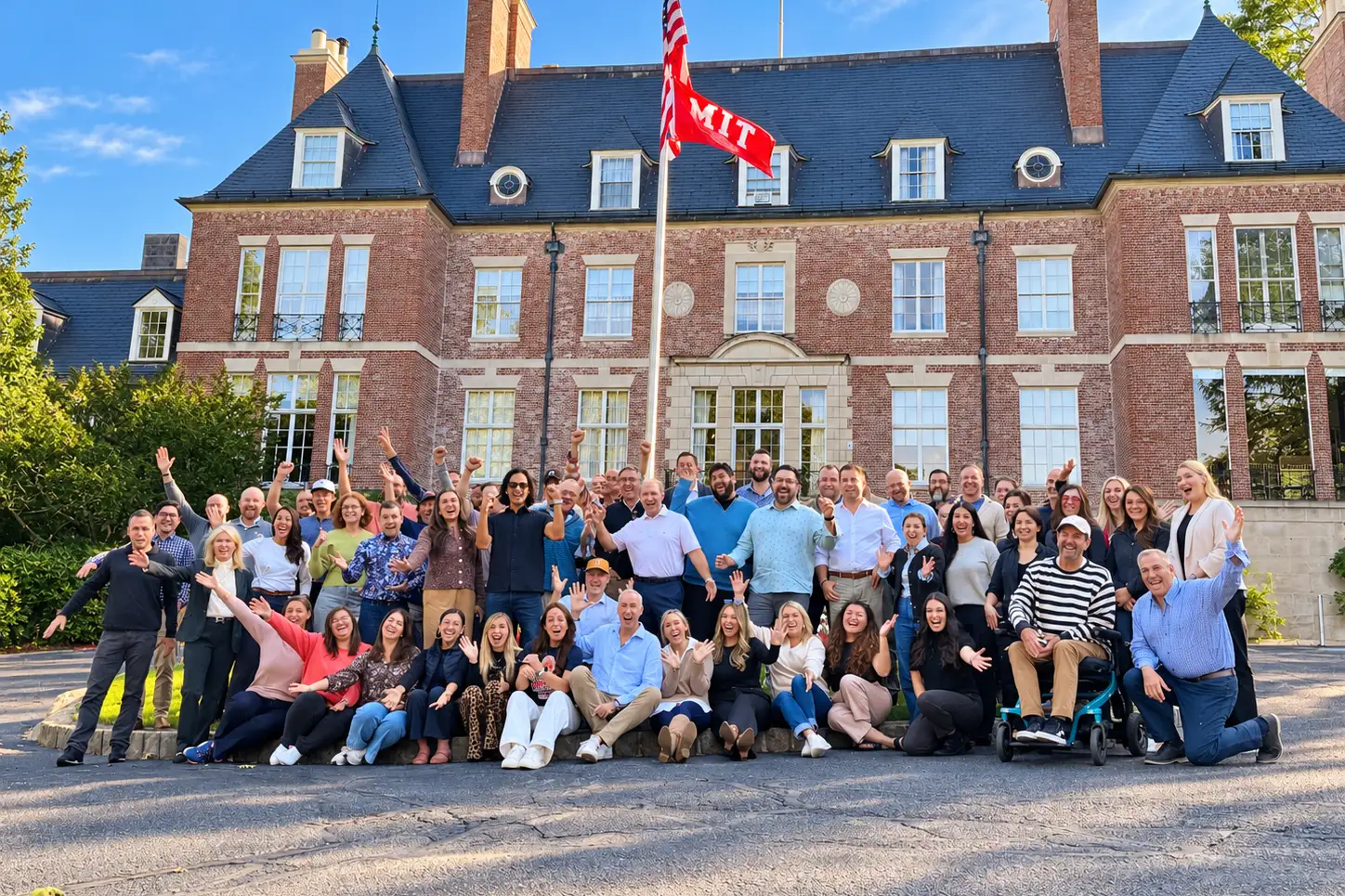 COO Alliance members posing together in front of the MIT mansion