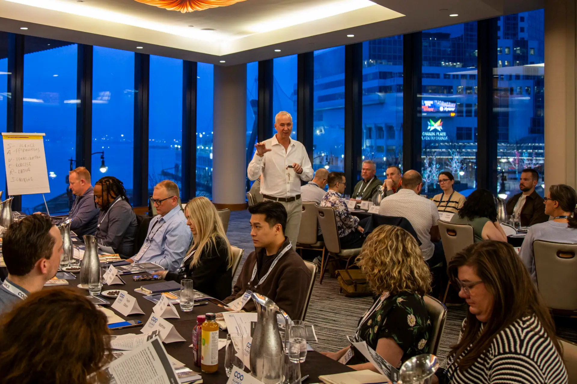 Members in conversation at a COO Alliance event